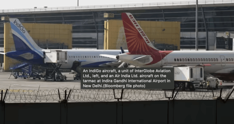 An IndiGo aircraft, a unit of InterGlobe Aviation Ltd., left, and an Air India Ltd. aircraft on the tarmac at Indira Gandhi International Airport in New Delhi.(Bloomberg file photo)