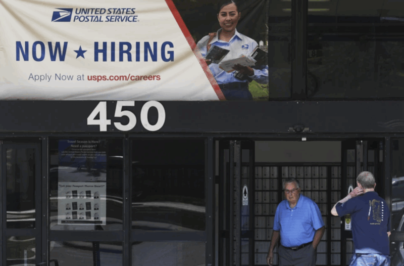 A hiring sign is displayed at a post office in Schaumburg, Ill., Thursday, Sept. 18, 2025. (AP Photo/Nam Y. Huh)