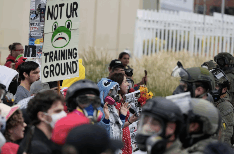 Demonstrators standoff against Immigration and Customs Enforcement agents outside an ICE facility on Saturday, Oct. 4, 2025, in Portland, Ore. (AP Photo/Jenny Kane)